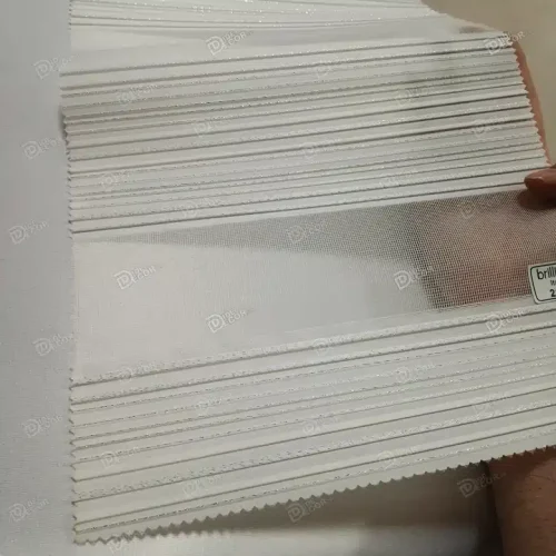 تصویر پرده زبرا پلیسه دار کد T2114 با رنگ سفید شیری با سیم دوزی نقره ای و بافت توری ریز مناسب نشیمن مدرن